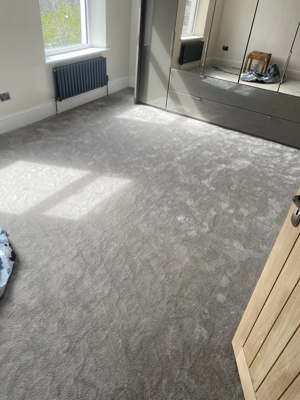 Grey carpet in a bedroom