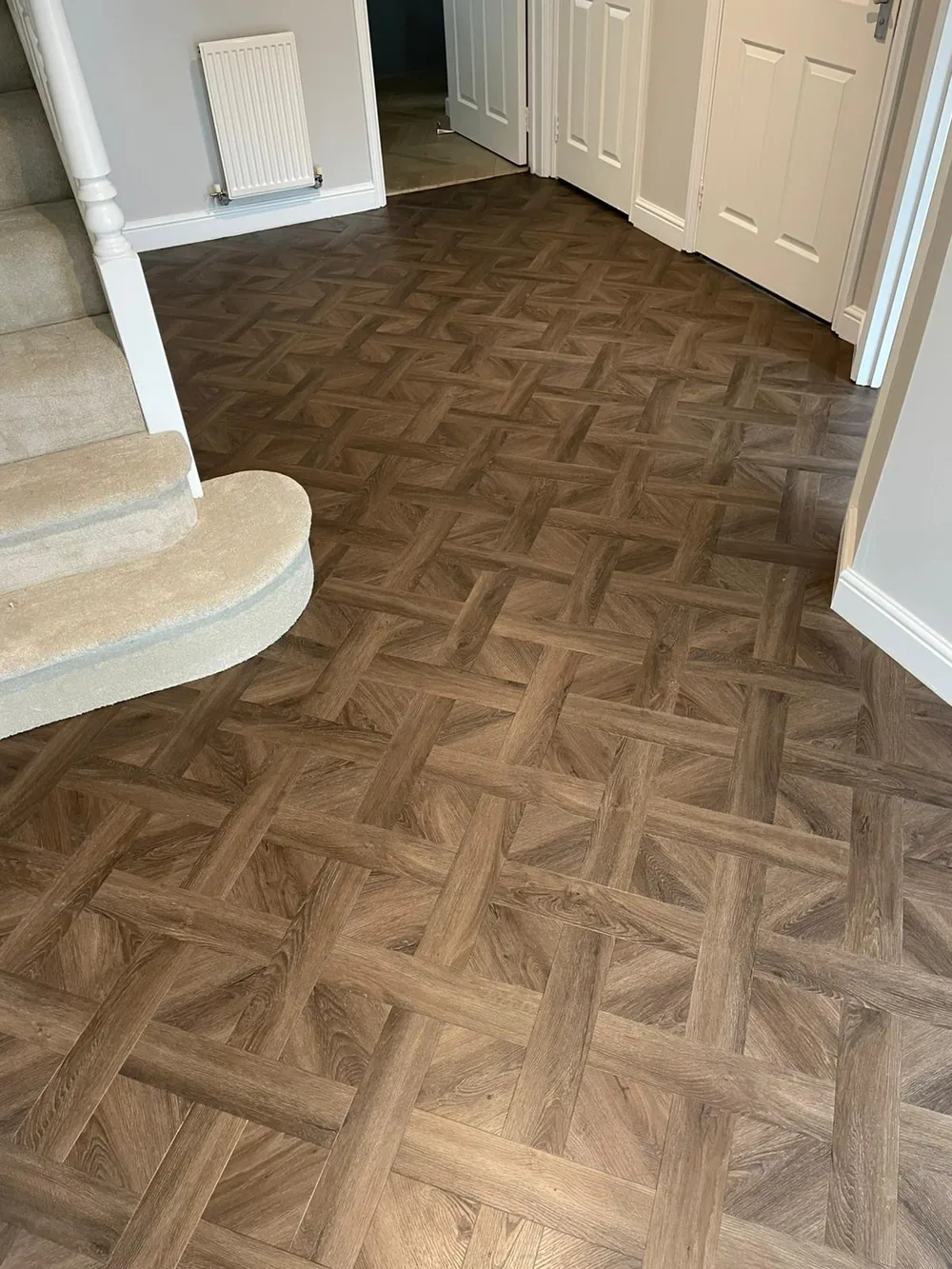Basketweave parquet-effect LVT in a hallway
