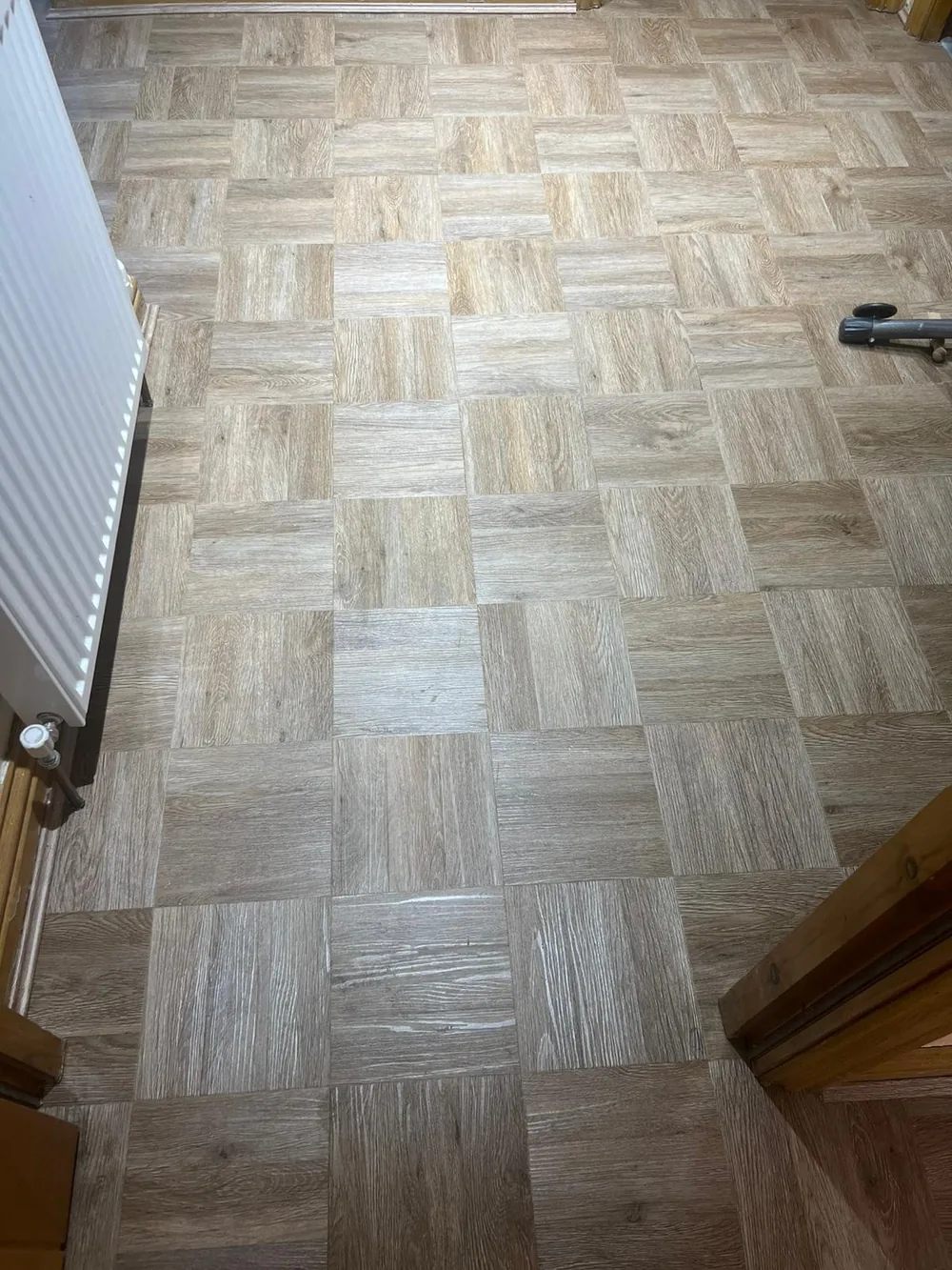 Parquet-effect LVT squares in a hallway