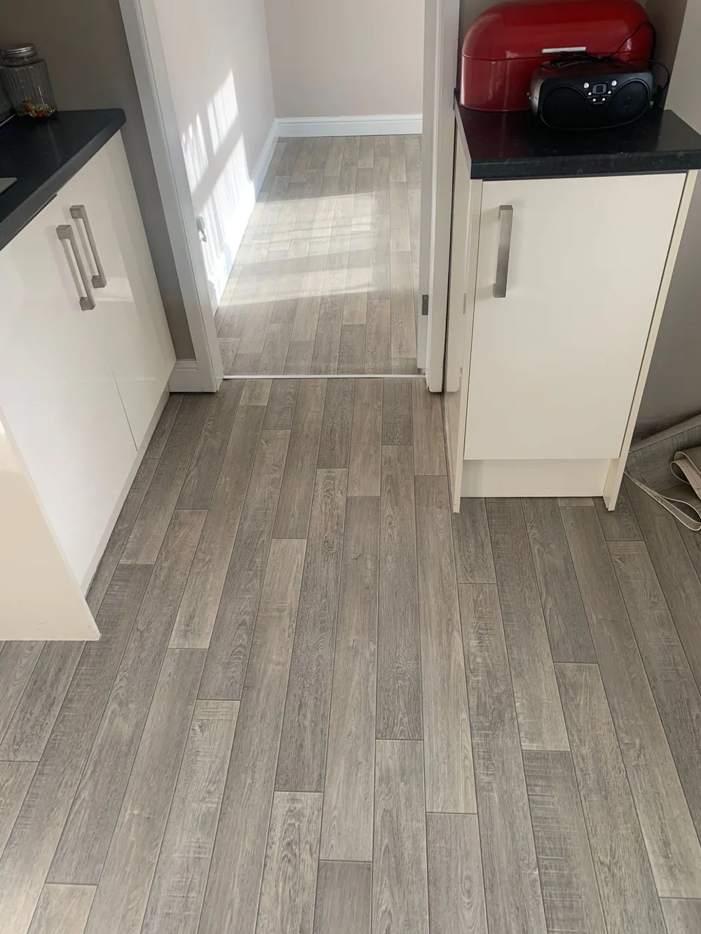 Grey wood-effect vinyl in a kitchen